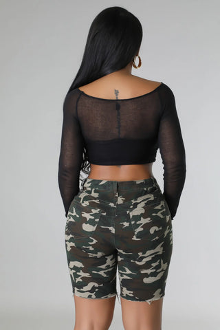 backview of distressed camo high waisted shorts with ripped detail and button zipper closure