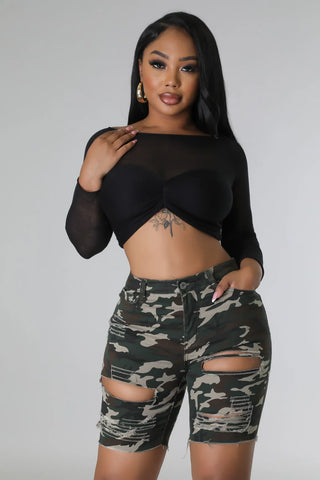 Front view of distressed camo high waisted shorts with ripped detail and button zipper closure