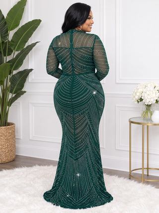 Back view of the emerald rhinestone mesh gown showing the sheer upper back, back zipper and mermaid hem