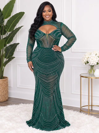 Front view of the plus size emerald green rhinestone mermaid gown with mock neck keyhole cutout, corset-style bodice and sheer long sleeves