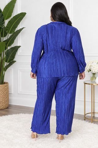 Back view of plus size royal blue pleated shirt and wide-leg pants set with lettuce-edge hem
