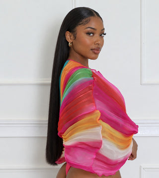 Side view of the multicolor pleated chiffon bodysuit with batwing sleeves and lettuce-edge hems