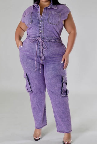 Plus size lavender washed denim cargo jumpsuit with short sleeves, button front, drawstring waist, and wide leg fit
