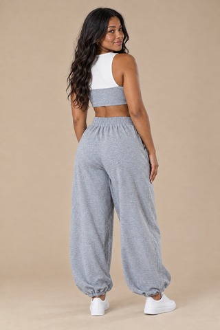 Back view of the Riviera Off-Duty set showing the white and gray crop top, elastic waistband and wide legs gathered at the ankle