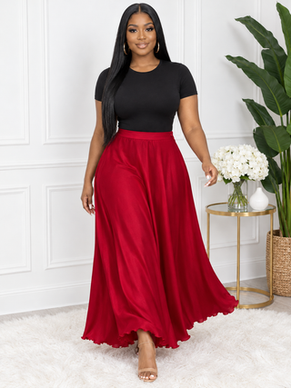Red flowy maxi skirt in motion showing full A-line swing and lettuce-edge hem