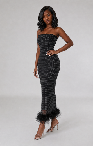 Side view of petite black rhinestone strapless dress showing the fitted bodycon silhouette