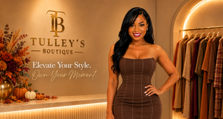 Woman in a chocolate brown strapless midi dress at Tulley's Boutique with fall flowers and pumpkins