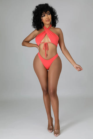 orange cutout bikini set with criss cross halter neckline
