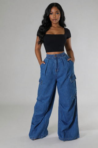 Front  view of Utility Muse medium\-blue denim cargo jeans with a petite\-friendly waist and wide\-leg fit\.